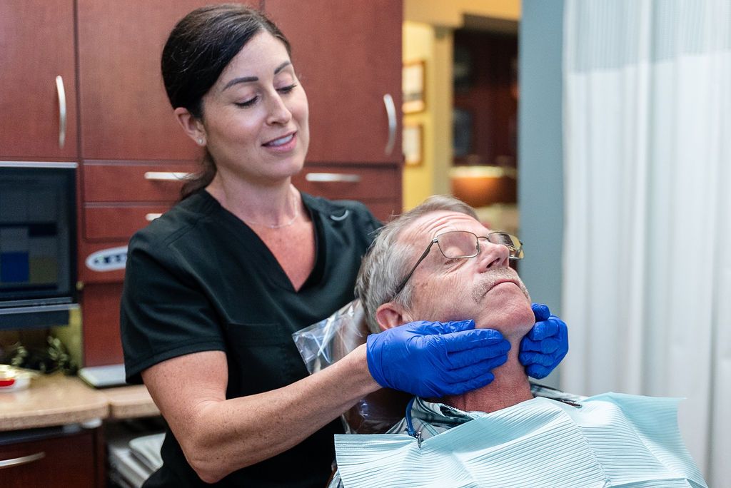 Dentist performing an airway assessment at Robert A. Lantzy DMD, ReCODE Dementia Protocol in Newtown, PA