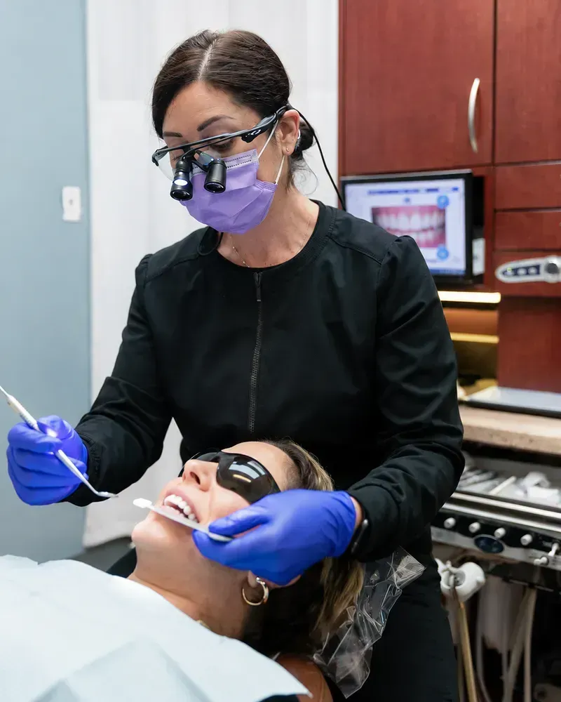 Dentist performing cosmetic dental treatment at Robert A. Lantzy DMD, Cosmetic Dentistry in Newtown, PA