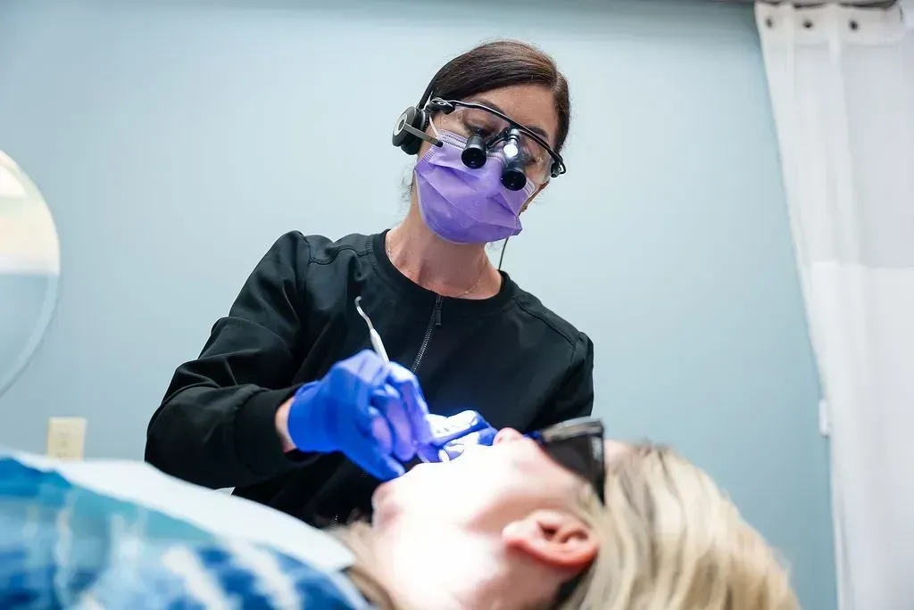 Dentist restoring a patient's tooth at Robert A. Lantzy DMD, Restorative Dentistry in Newtown, PA