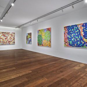Art Gallery With Colorful Abstract Paintings Displayed Along White Walls at Robert A. Lantzy, DMD, LCC in Newtown, PA