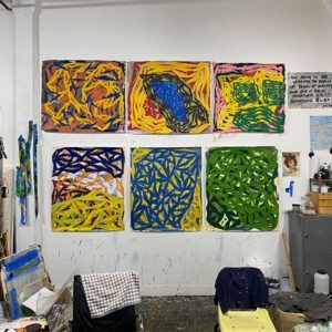 Colorful Abstract Paintings Arranged in a Grid on a Studio Wall at Robert A. Lantzy, DMD, LCC in Newtown, PA