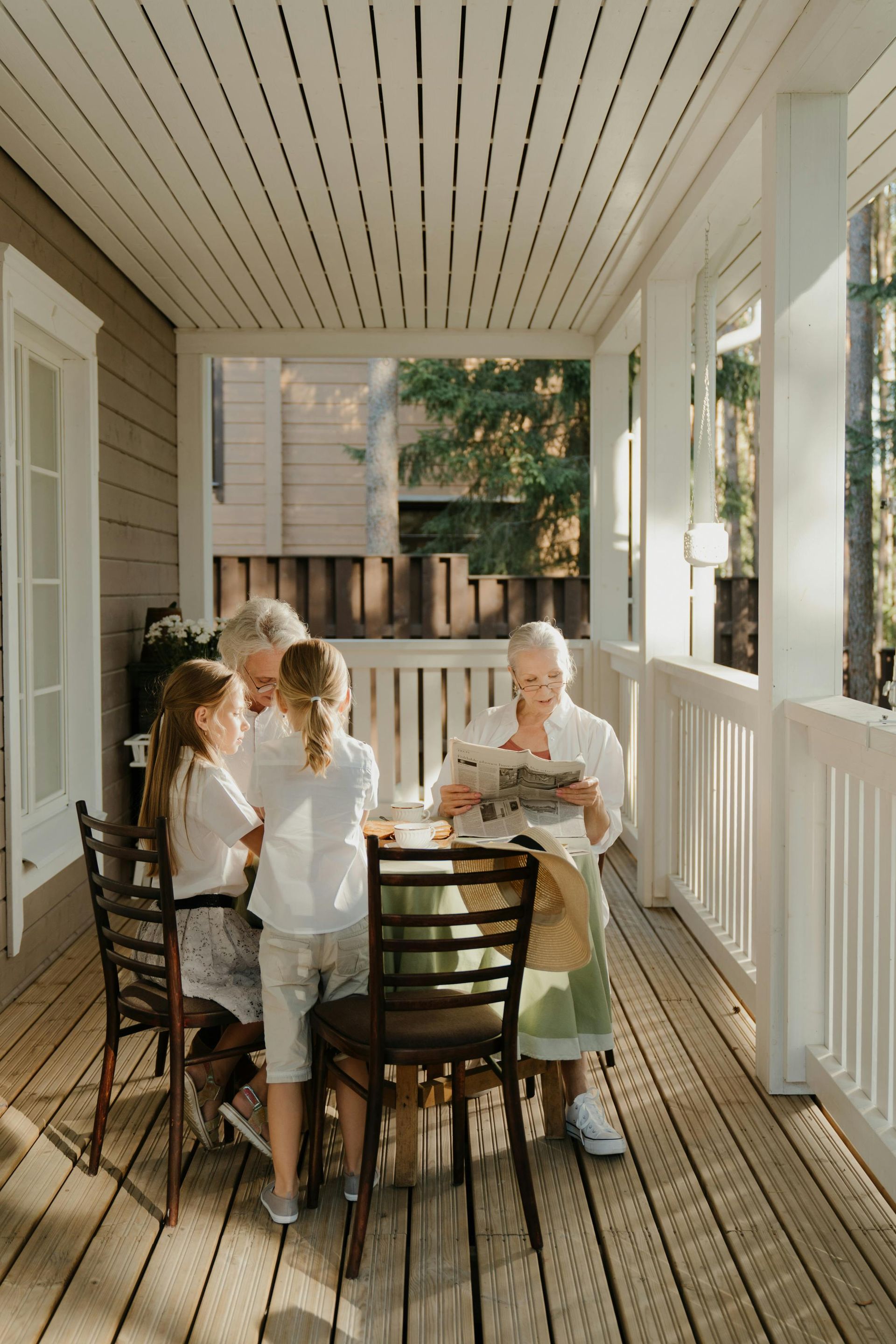 grandparents with grandchildren on patio in home retirement community love family
