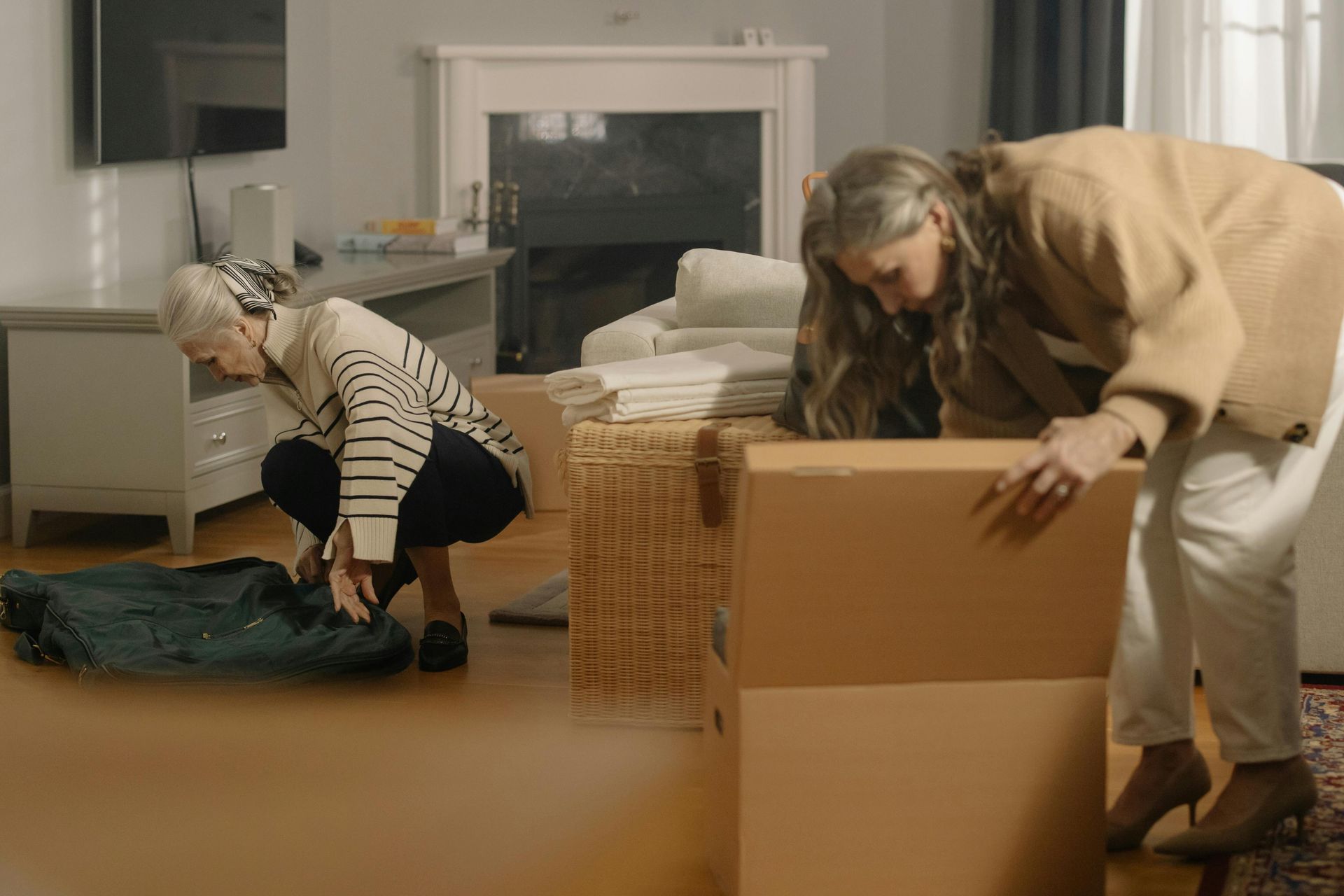 family moving into home grandparent retirement elderly packing boxes moving love 