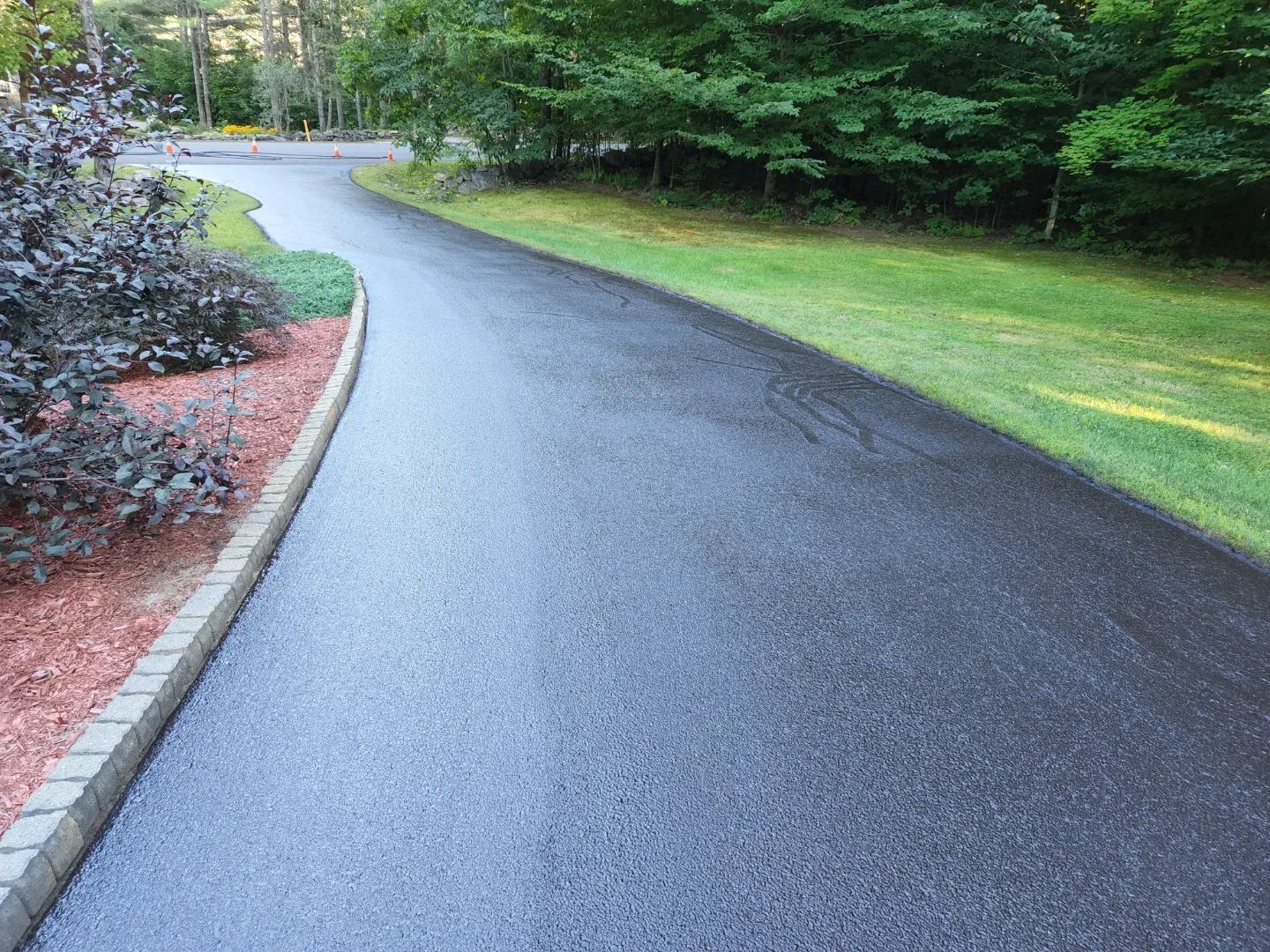 Asphalt sealcoating