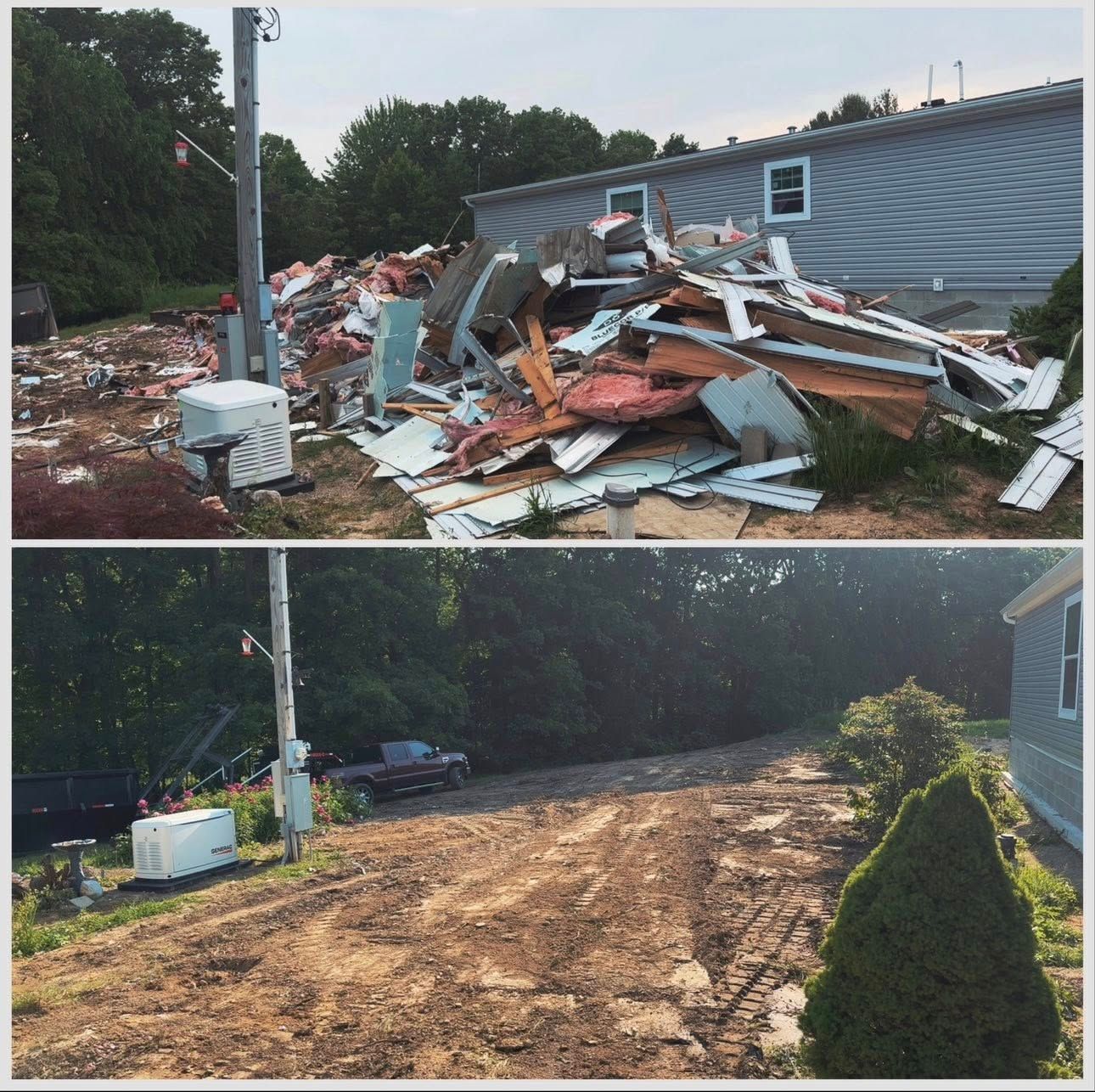 Storm debris pile beside a house, with a cleared dirt path after cleanup.