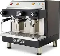 Black and stainless steel Astra espresso machine with spouts, knobs, and a drip tray.
