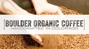 Hands sifting coffee beans, with the text 