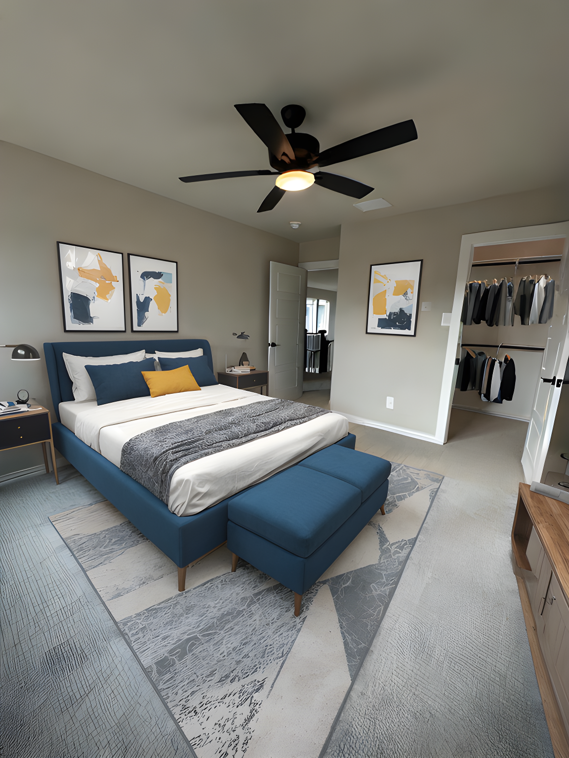 A bedroom with a large bed , a ceiling fan , and a walk in closet.