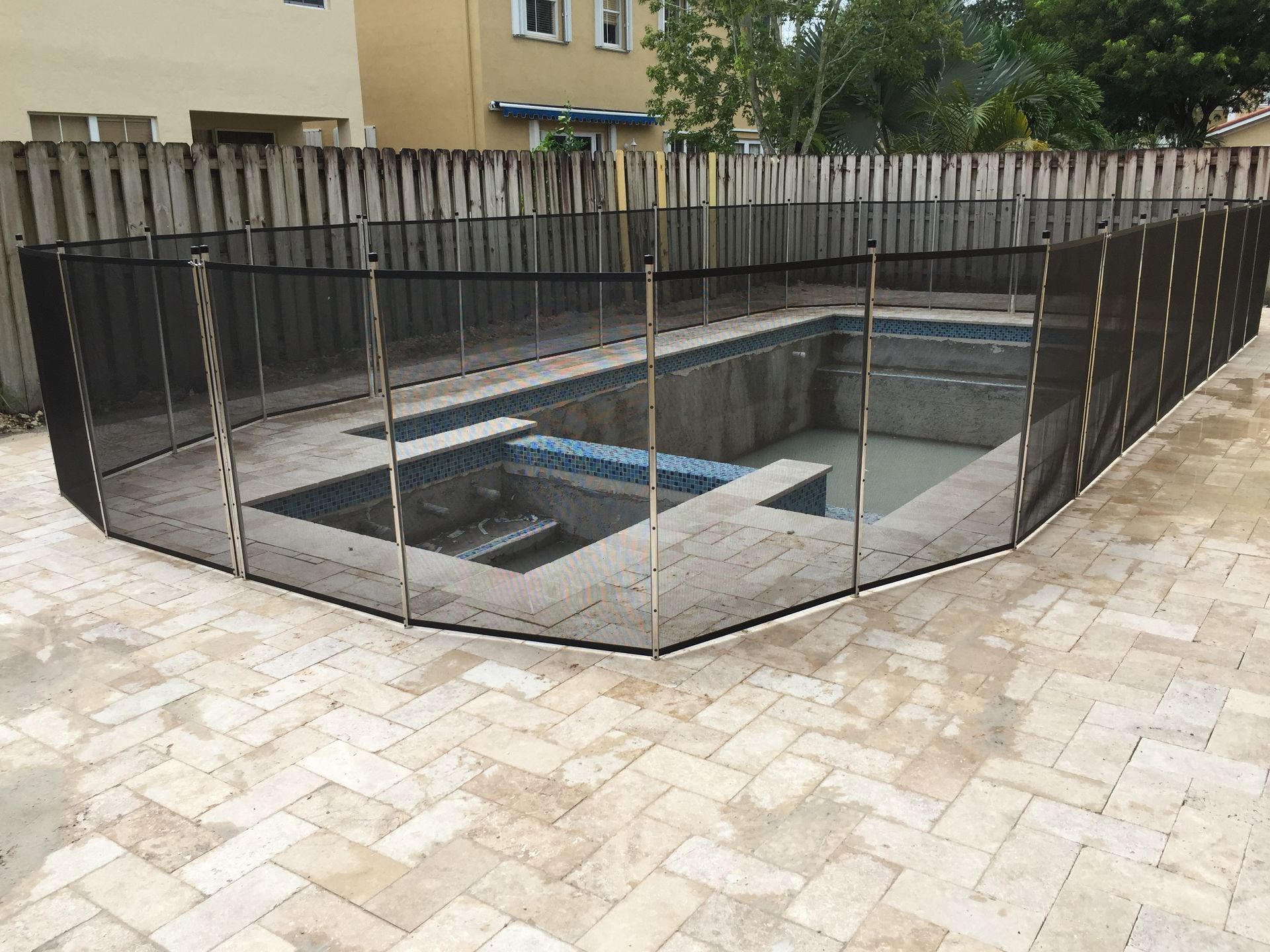 a swimming pool with a fence around it