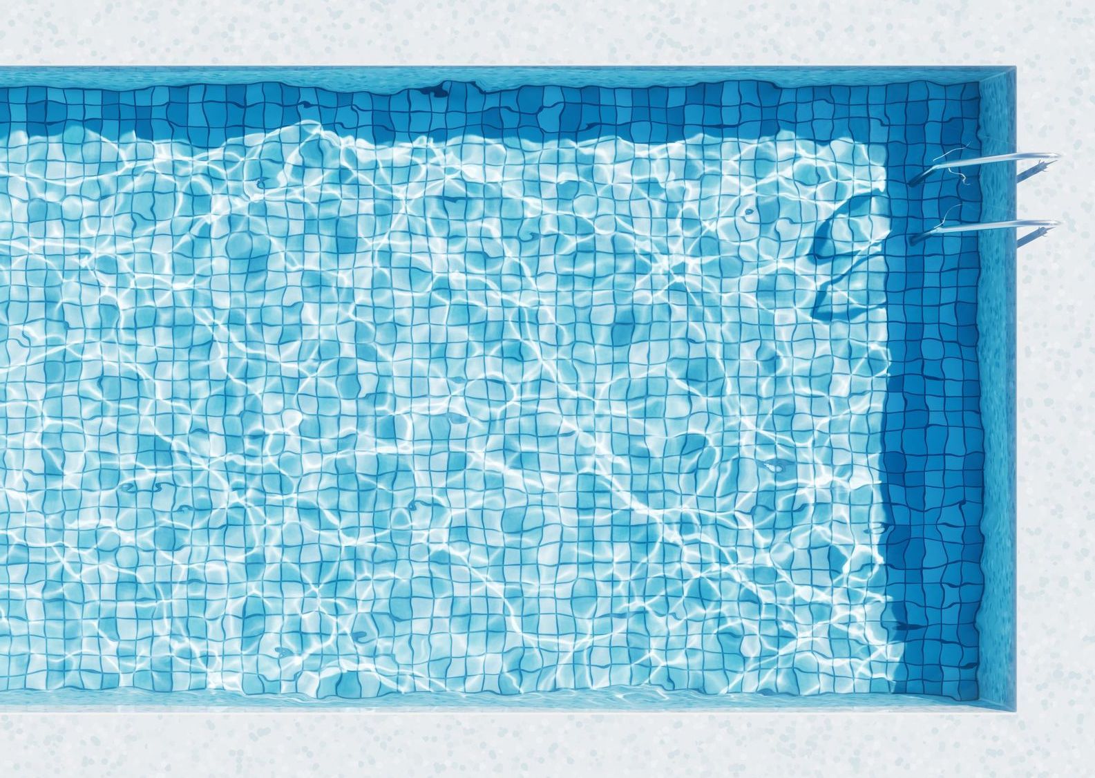 an aerial view of a swimming pool with a person swimming in it .