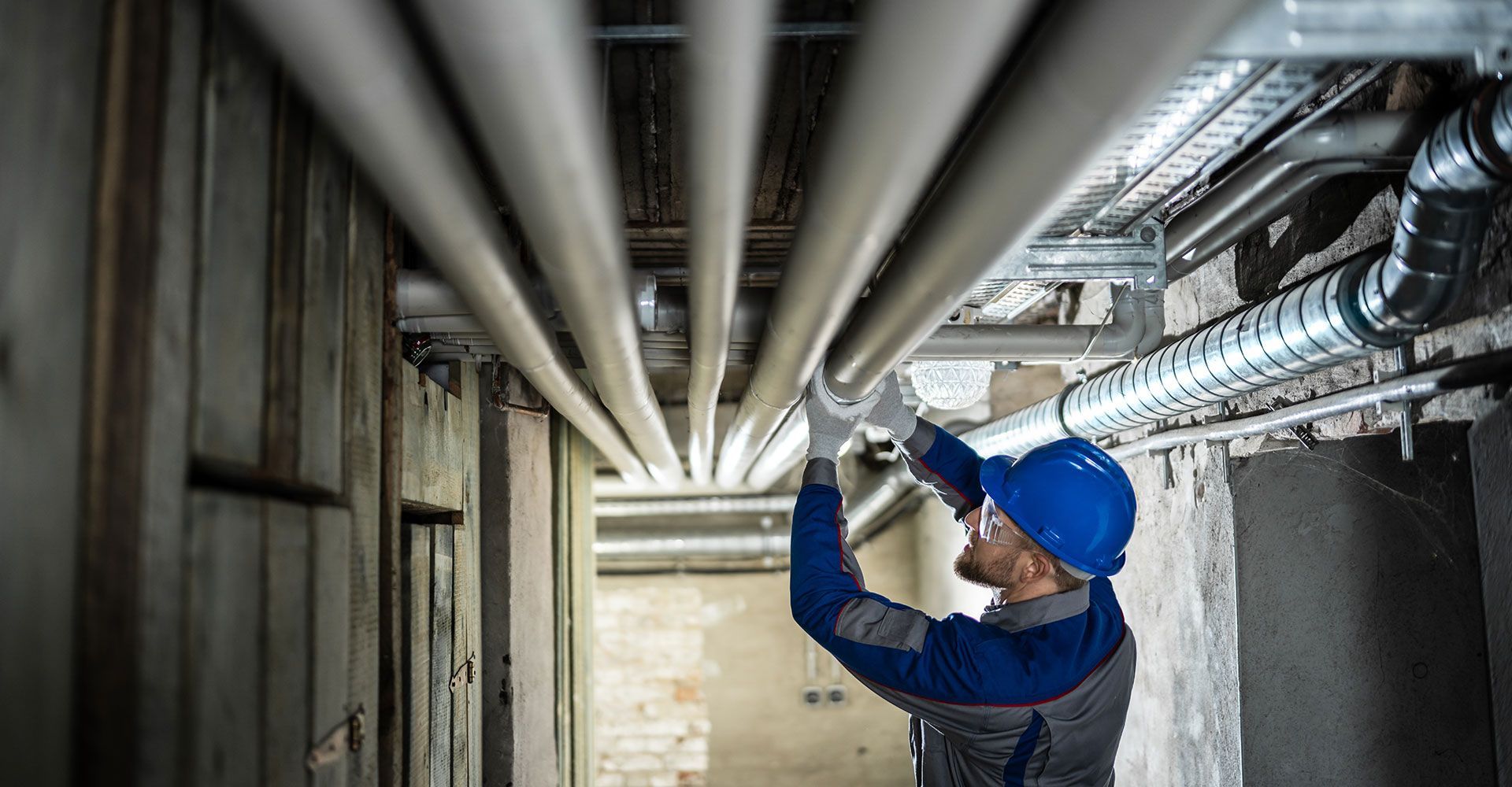 Man Fixing the Water Pipes