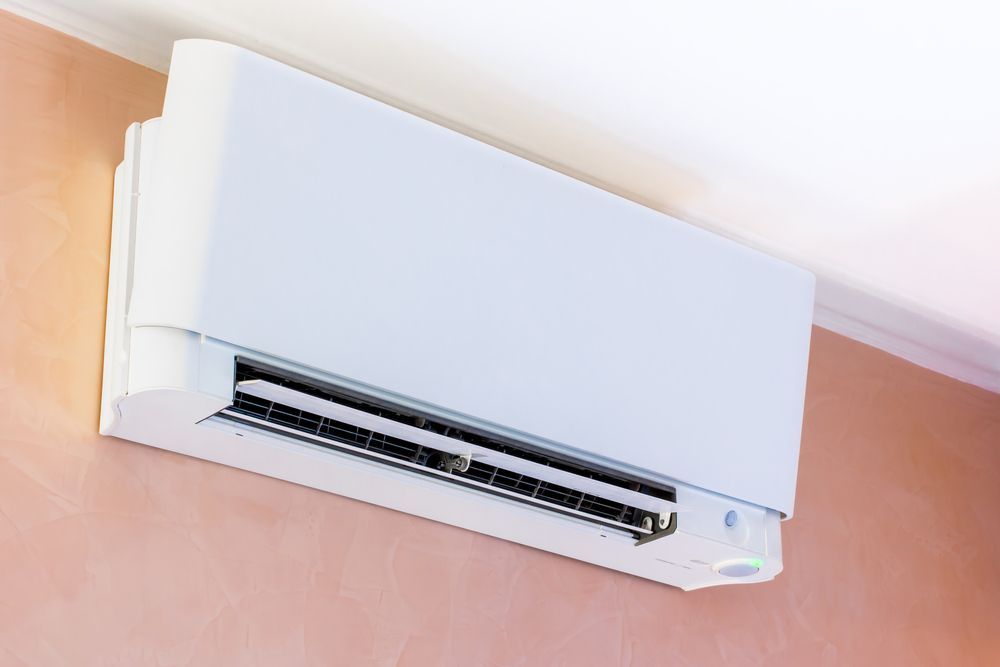 An Air Conditioner on A Wall — Paul Wiedman Electrical in Oakey, QLD