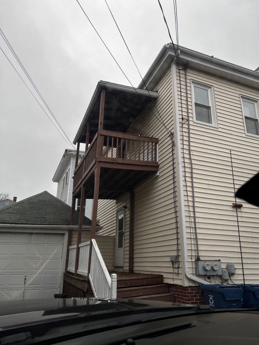 Before photo of a 2nd story deck teardown