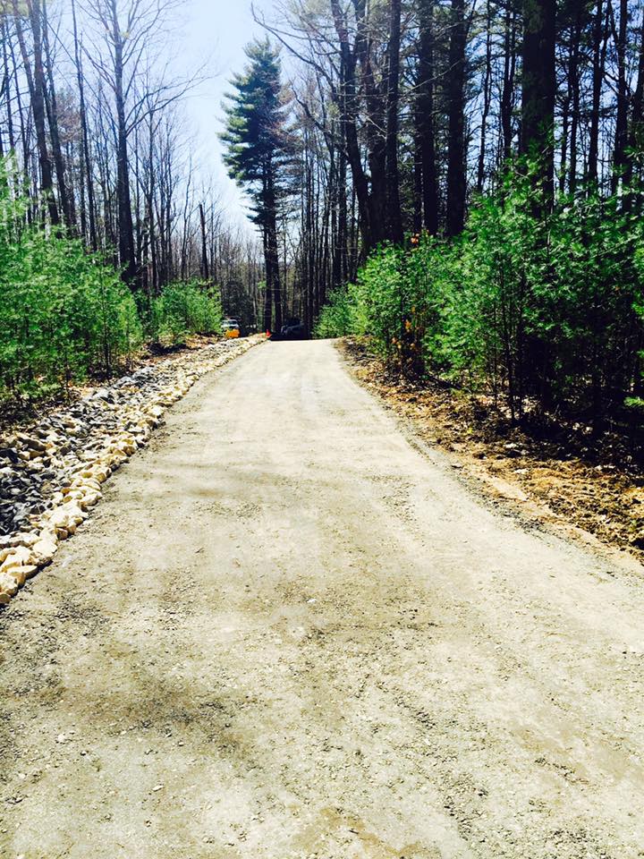After photo of driveway with rocking in Maine