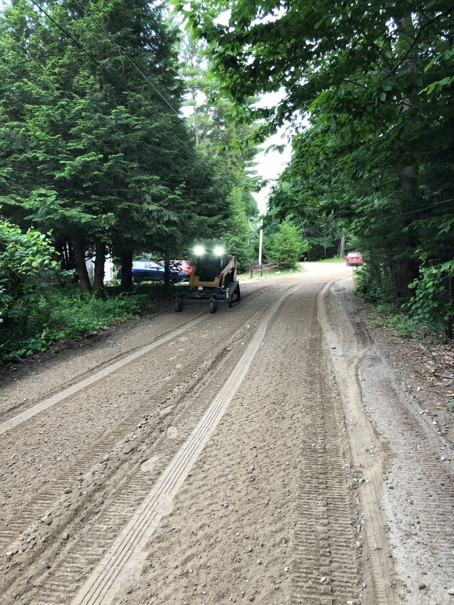 Repairing dirt road in Maine