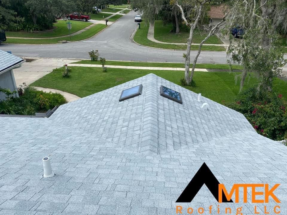 View from a roof over a suburban neighborhood street and lawns