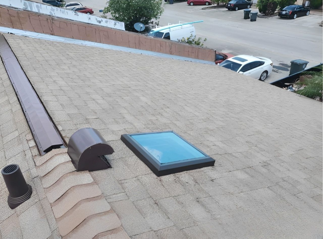 Red tiled roof with several skylight windows