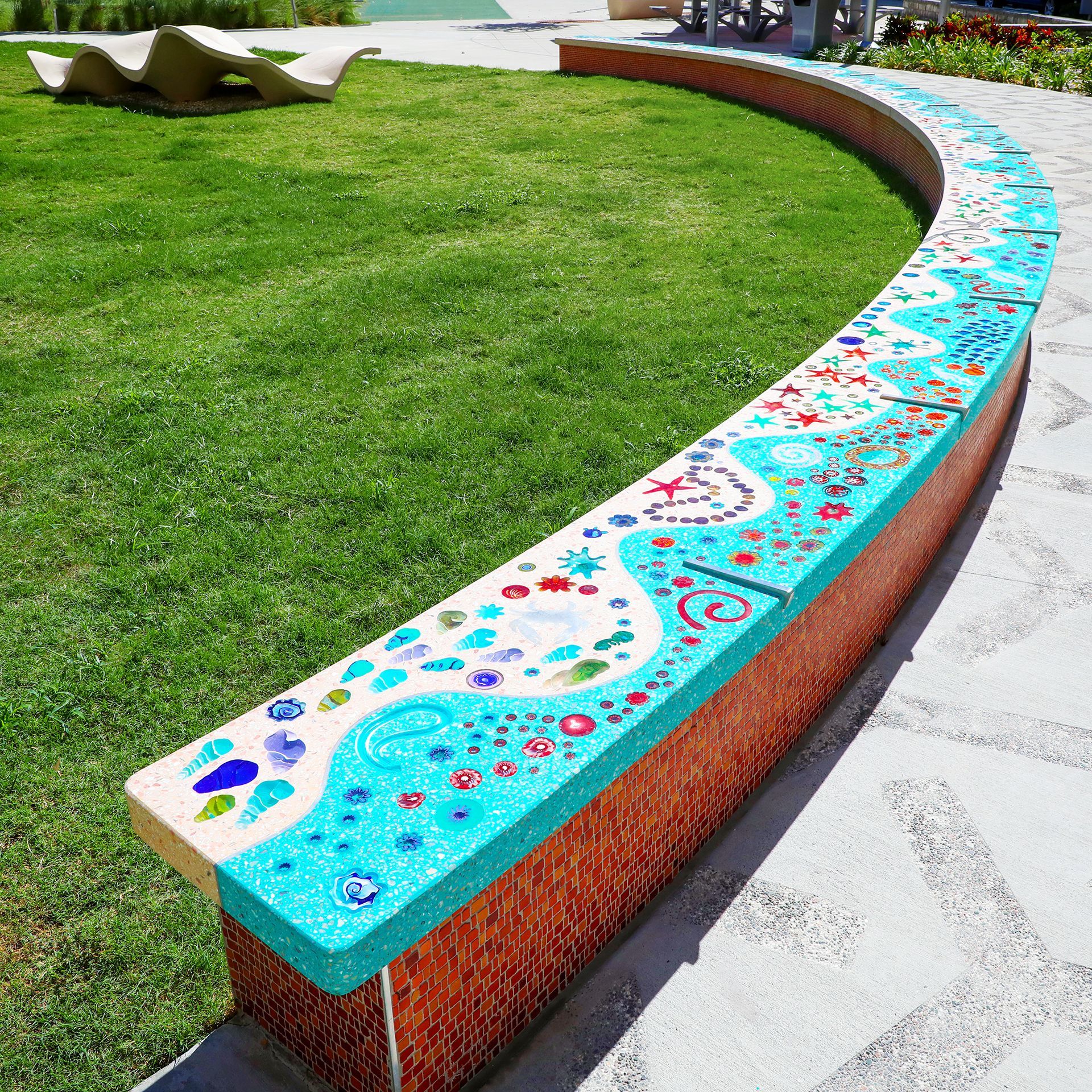 A brick wall with a blue and white design on it