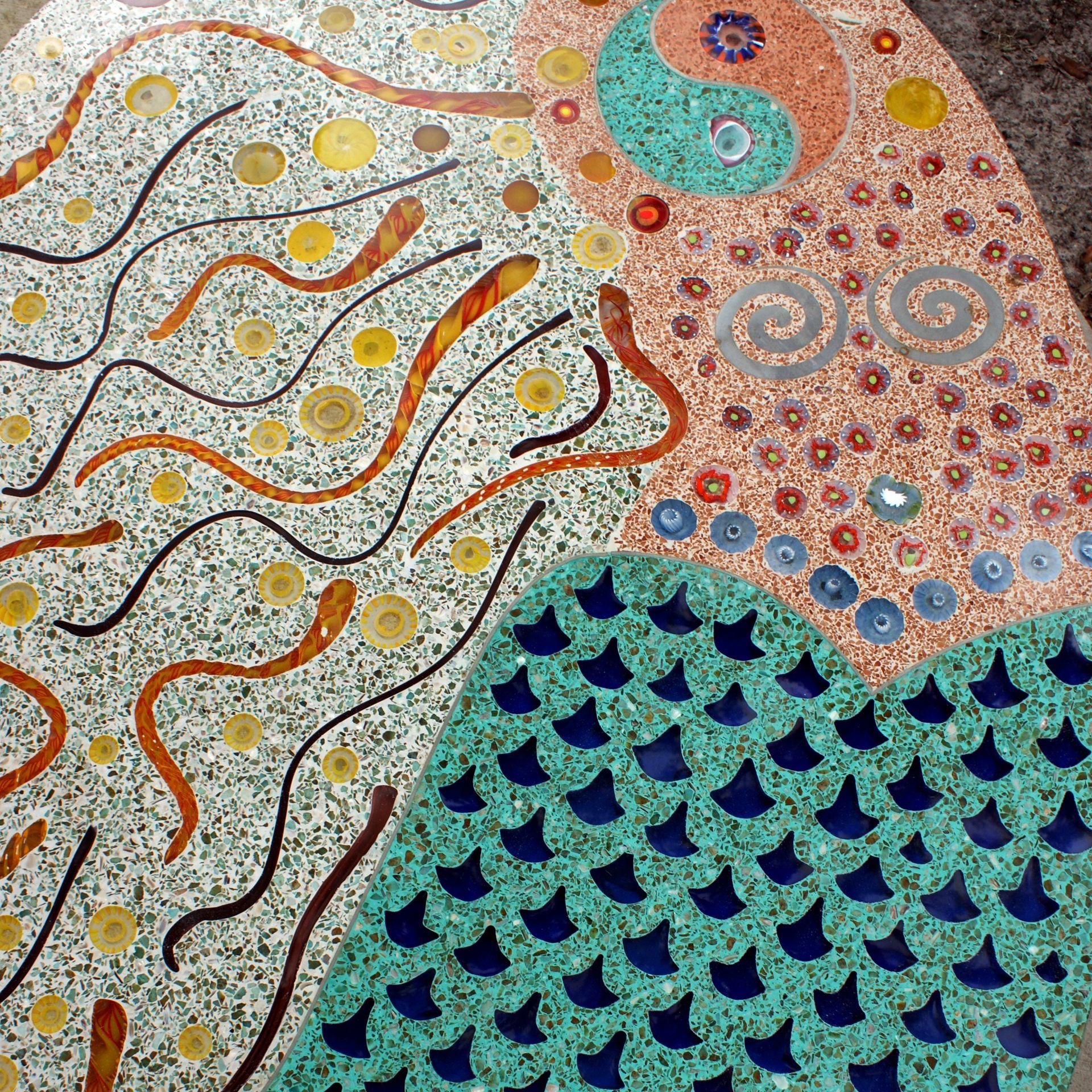 A colorful mosaic with a snake on it