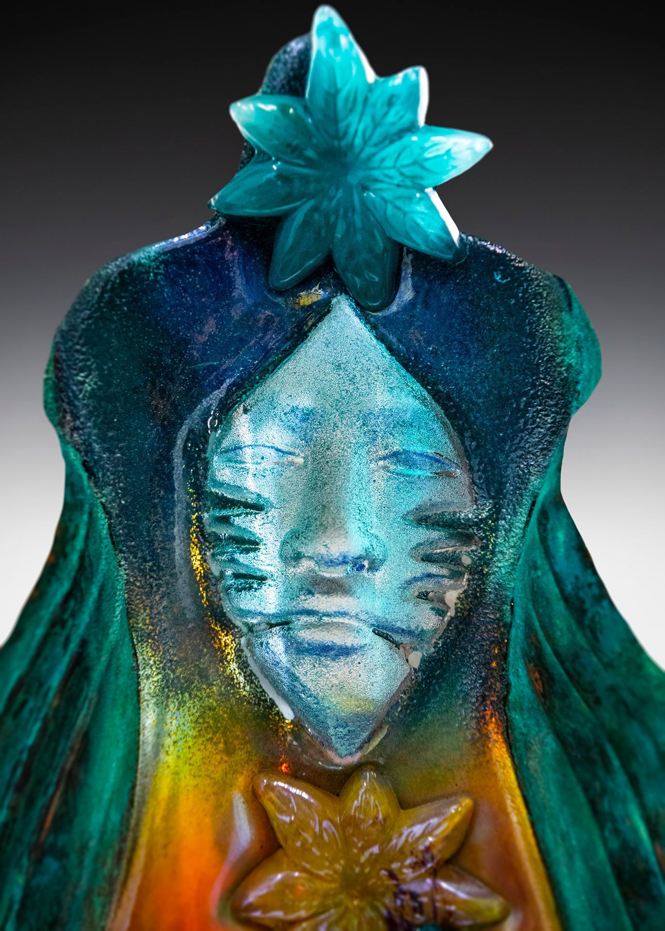 A statue of a woman with a flower in her hair
