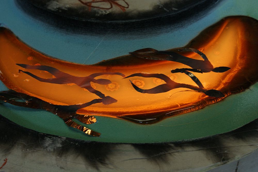 A painting of a banana with a flame on it
