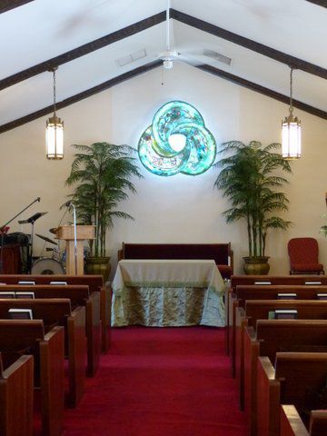 The inside of a church with a podium and altar