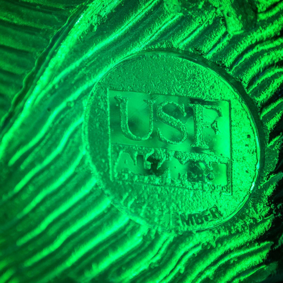 A close up of a green glow in the dark object.