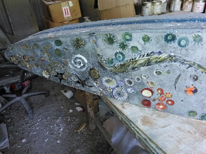 A large piece of glass is sitting on top of a table.
