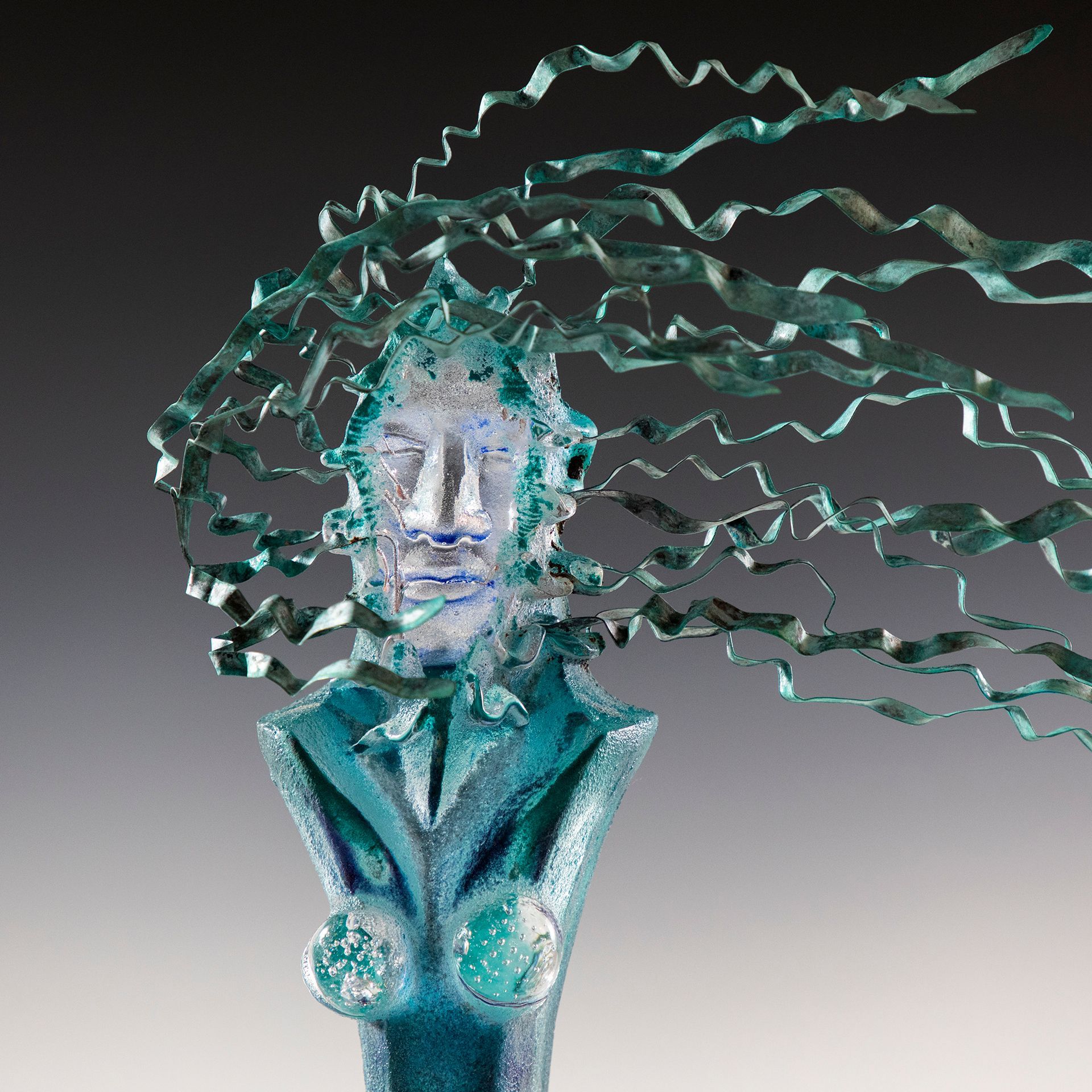 A statue of a woman with a wind blowing through her hair