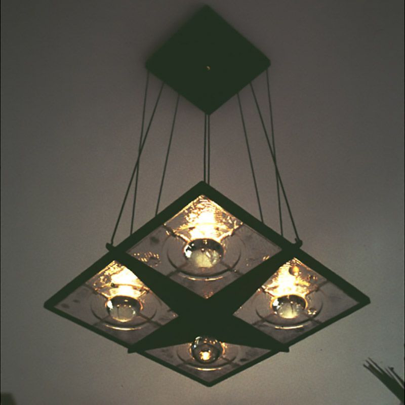 A square chandelier with four lights hanging from the ceiling