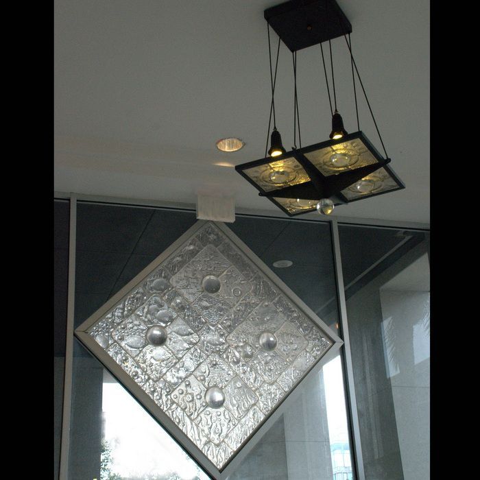 A ceiling light with a square in the middle