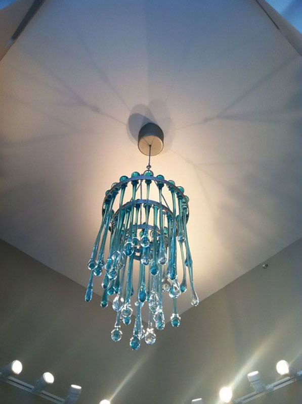 A chandelier with blue beads hanging from the ceiling