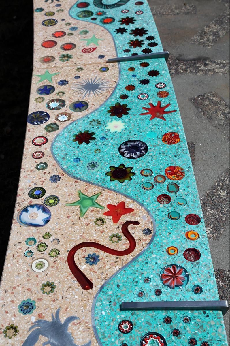 A painting of a river with flowers and stars on it