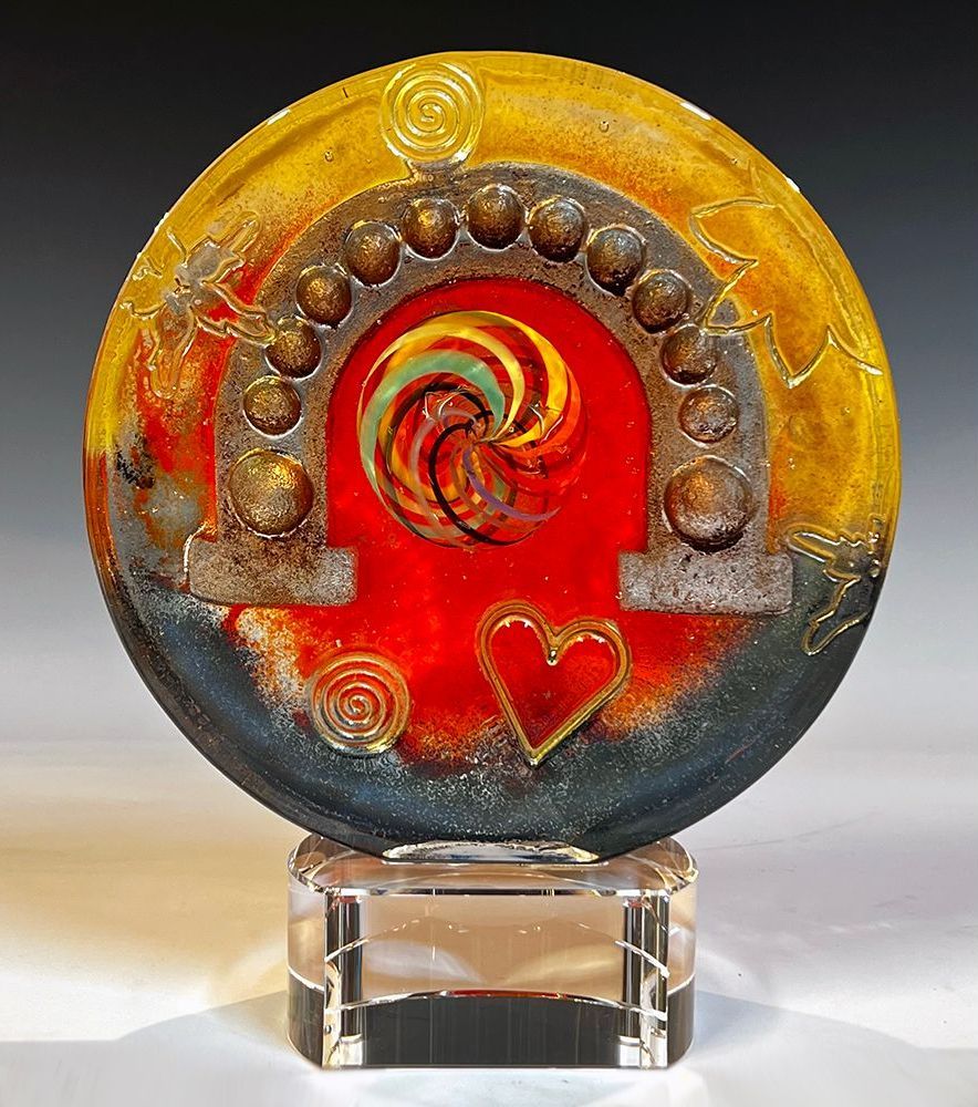 A sculpture of a horseshoe with hearts on it