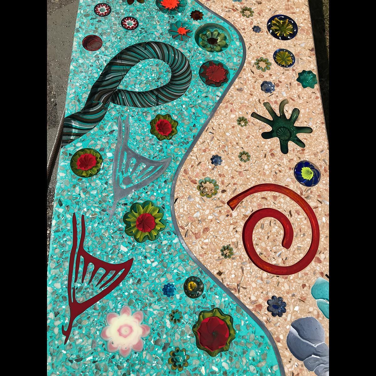 A painting of a river with flowers and swirls on it.
