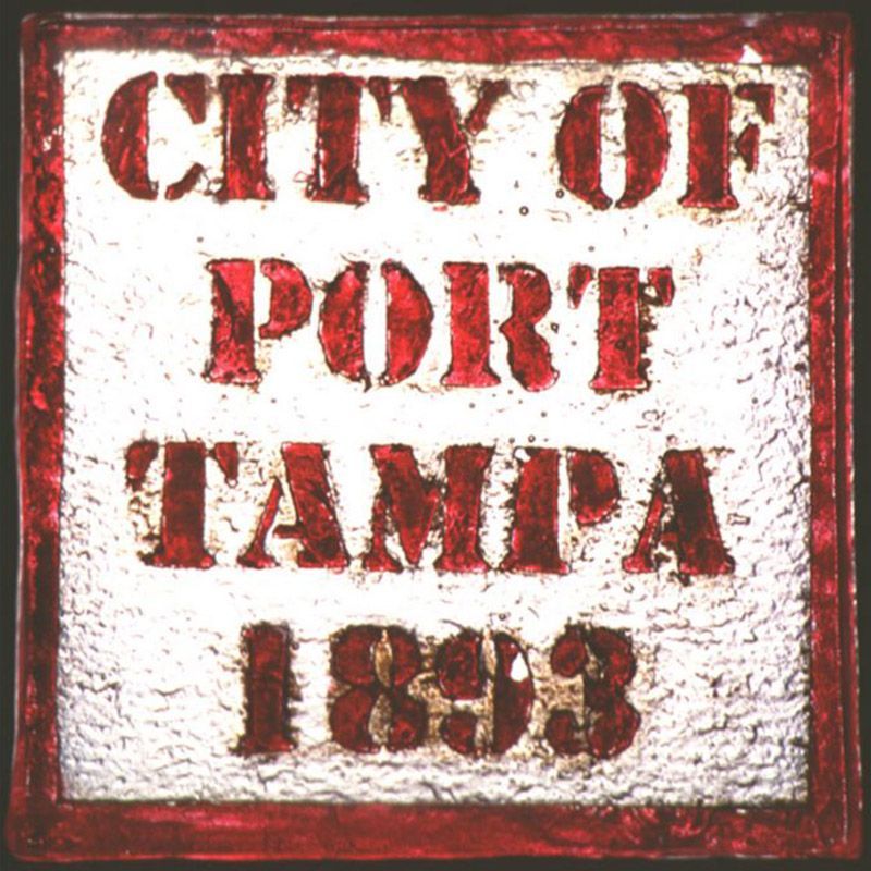 A red and white sign that says city of port tampa 1893
