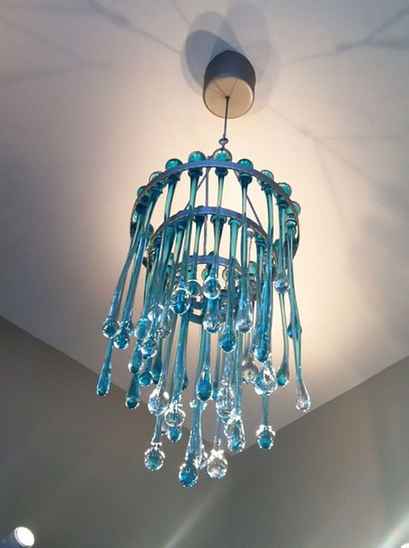 A blue chandelier is hanging from the ceiling