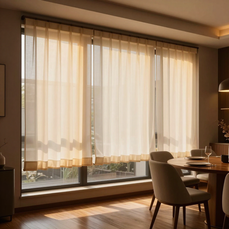 Sunlit modern dining room with sheer curtains, a table set for tea, and warm wooden flooring