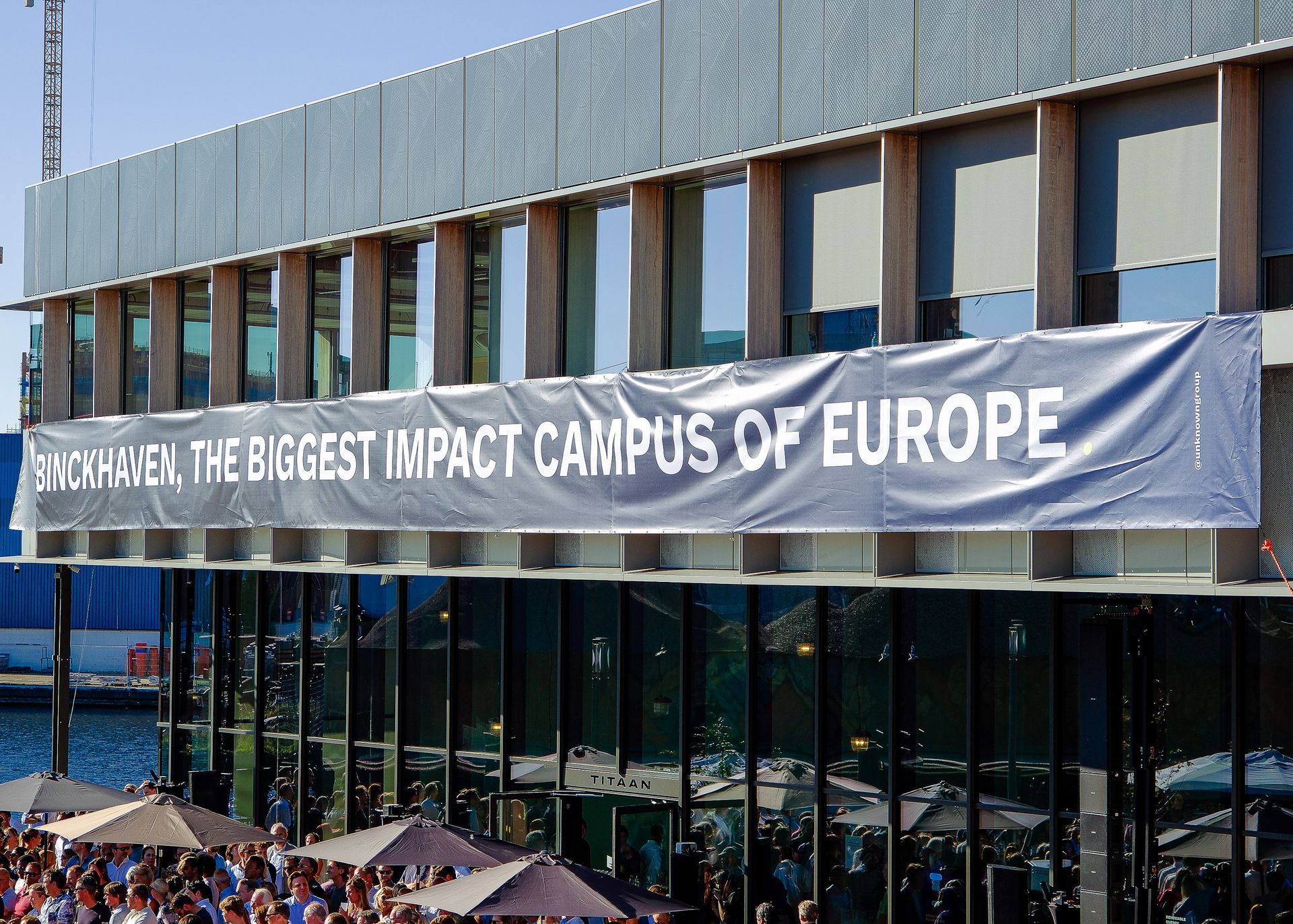 A large building with a banner that says the biggest impact campus of europe