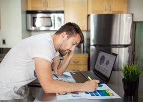 Small business owner reviewing a local SEO pricing budget on a laptop