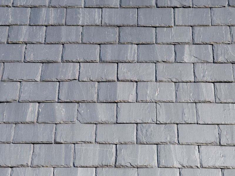 Gray shingle roof tiles in a repeating pattern