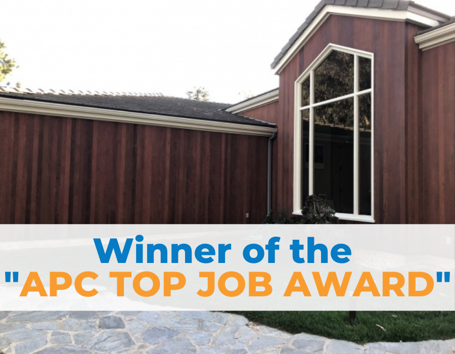 House exterior with dark wood siding, winning the