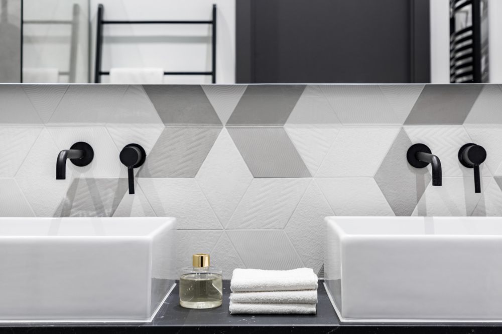 A Bathroom with Two Sinks and a Mirror — Hunter Valley Tile Mart in Maitland, NSW