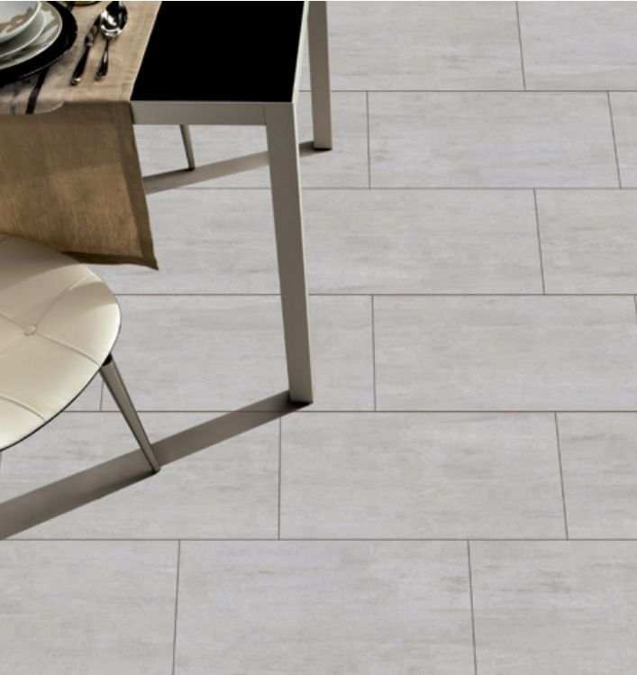A Tiled Floor with a Table and Chairs on it — Hunter Valley Tile Mart in Rutherford, NSW