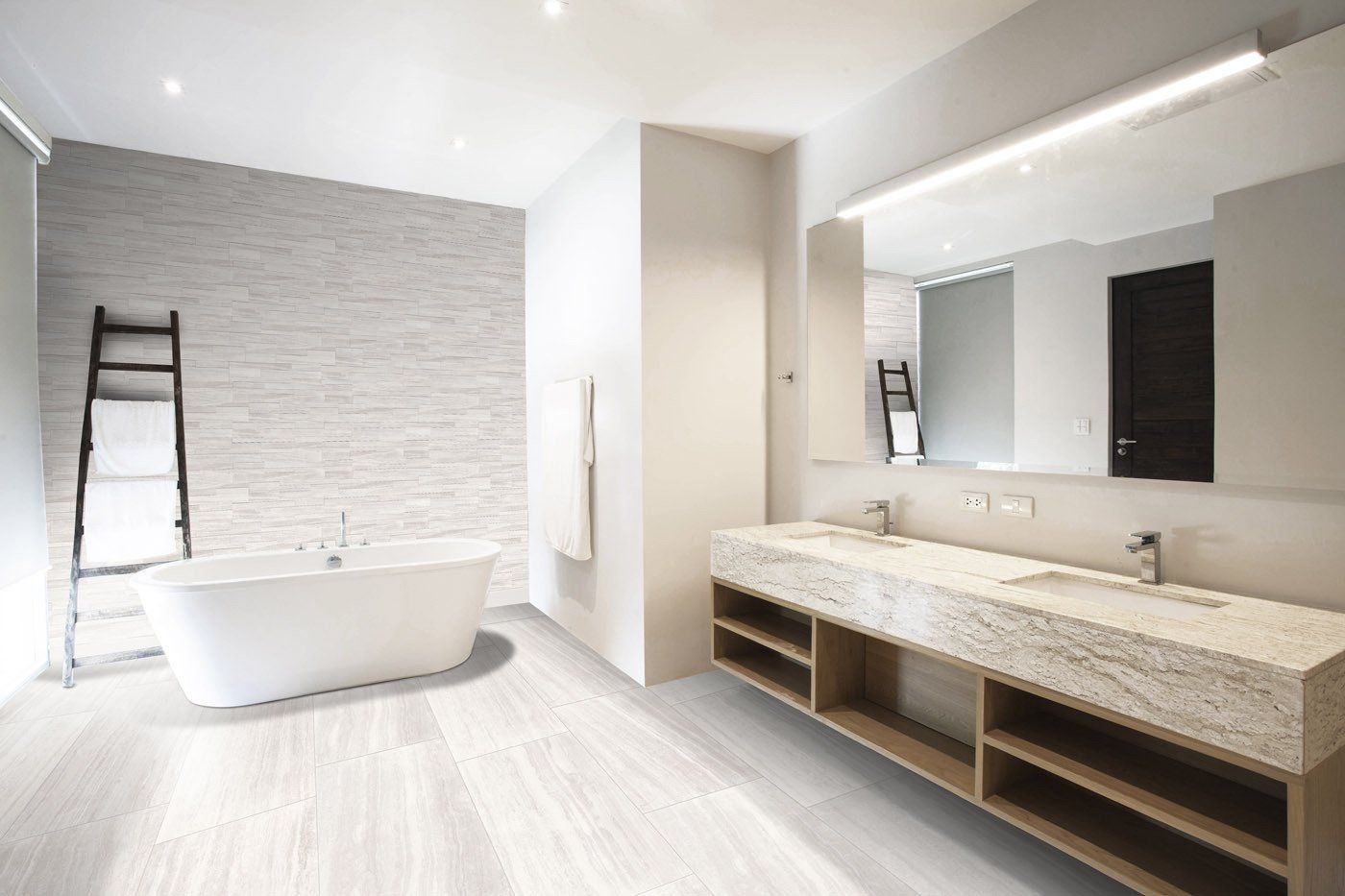White Bathtub On Grey Tiled Floor — Hunter Valley Tile Mart in Rutherford, NSW