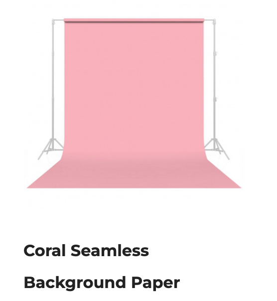 Coral seamless background paper on a studio backdrop stand with floor sweep