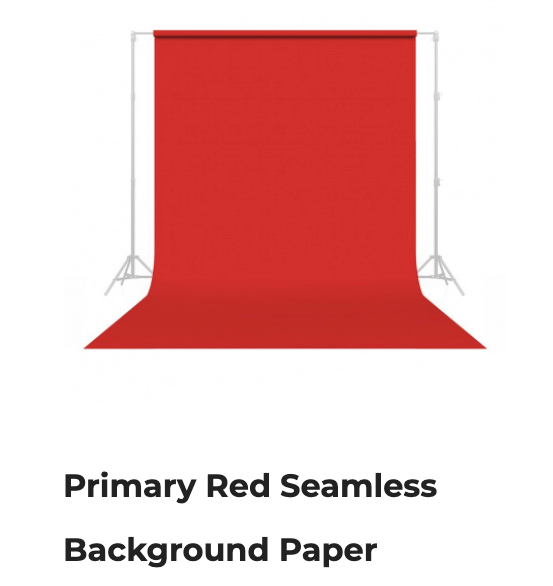 Red seamless backdrop paper on stands, with a rolled red sweep at the bottom.