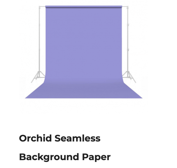 Purple seamless background paper backdrop on white stands, labeled “Orchid Seamless Background Paper”