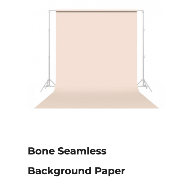Bone seamless background paper in a studio setup, light beige roll backdrop with side supports