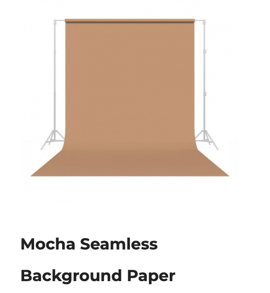 Mocha seamless backdrop paper roll with curved floor sweep on a white stand